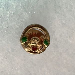Claddah pin with green and red stones